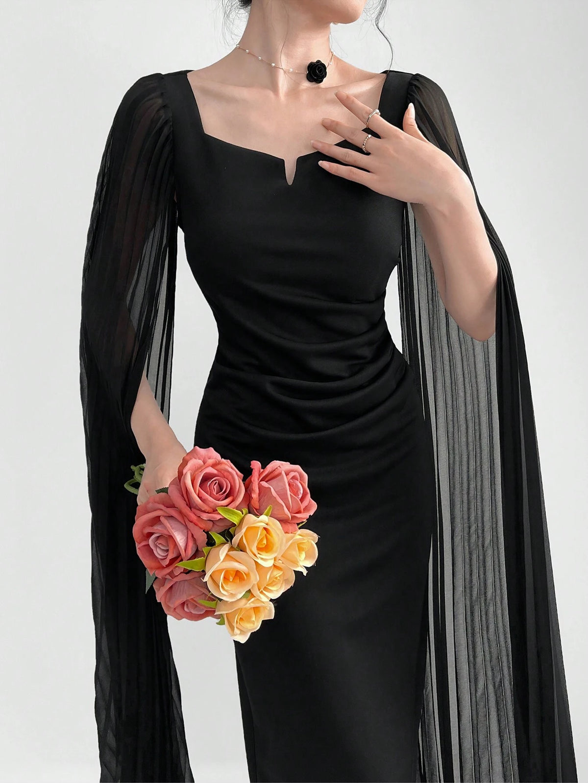 Modely Elegant Dress With A Notched Collar, Pleats, Cinched Waistline, Cape Sleeves