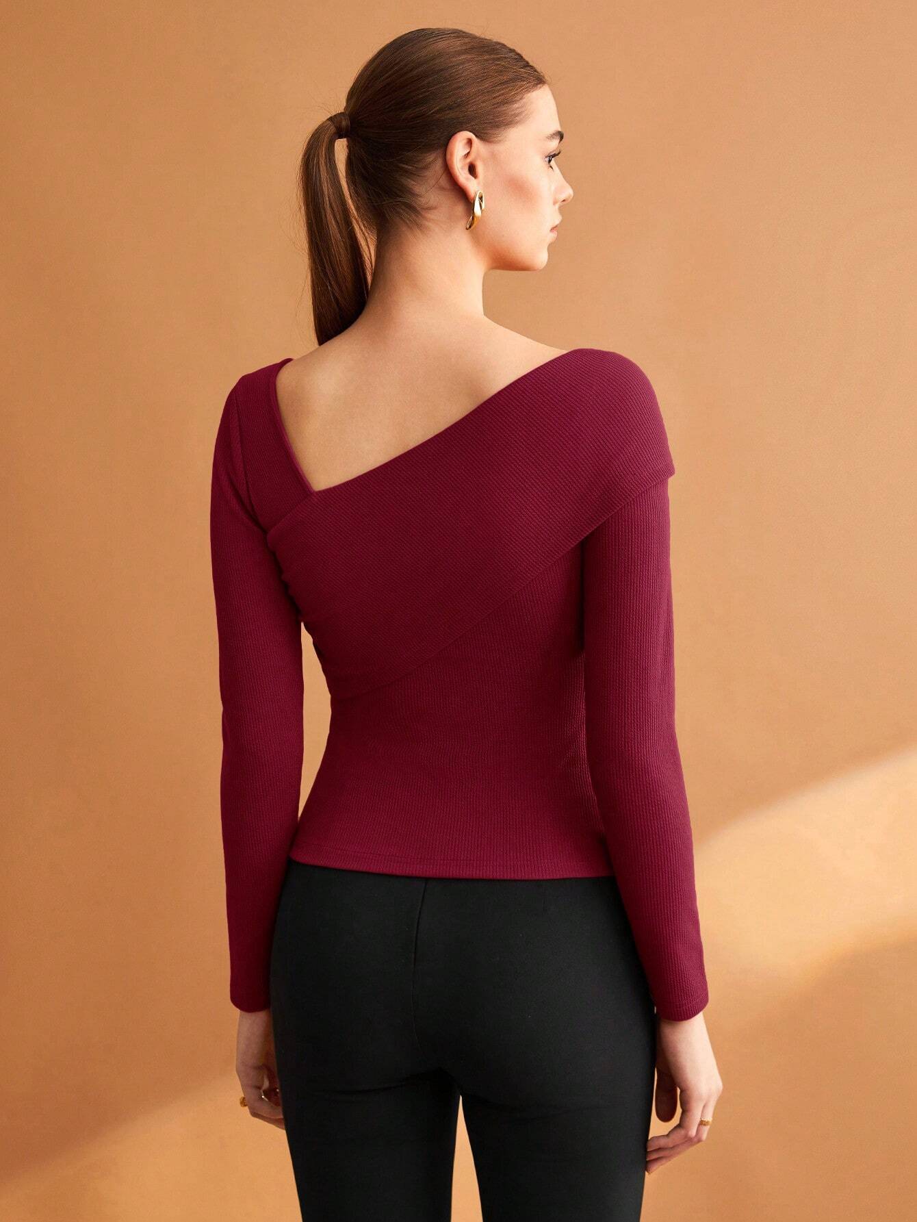 BIZwear Women's Black Solid Color Asymmetrical Neckline Stretch T-Shirt