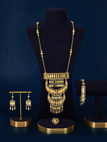 A Set Of Jewelry Including A Necklace, A Bracelet, A Ring, And A Pair Of Earrings